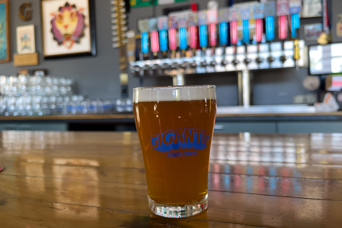 Gigantic Brewing beer on bar.