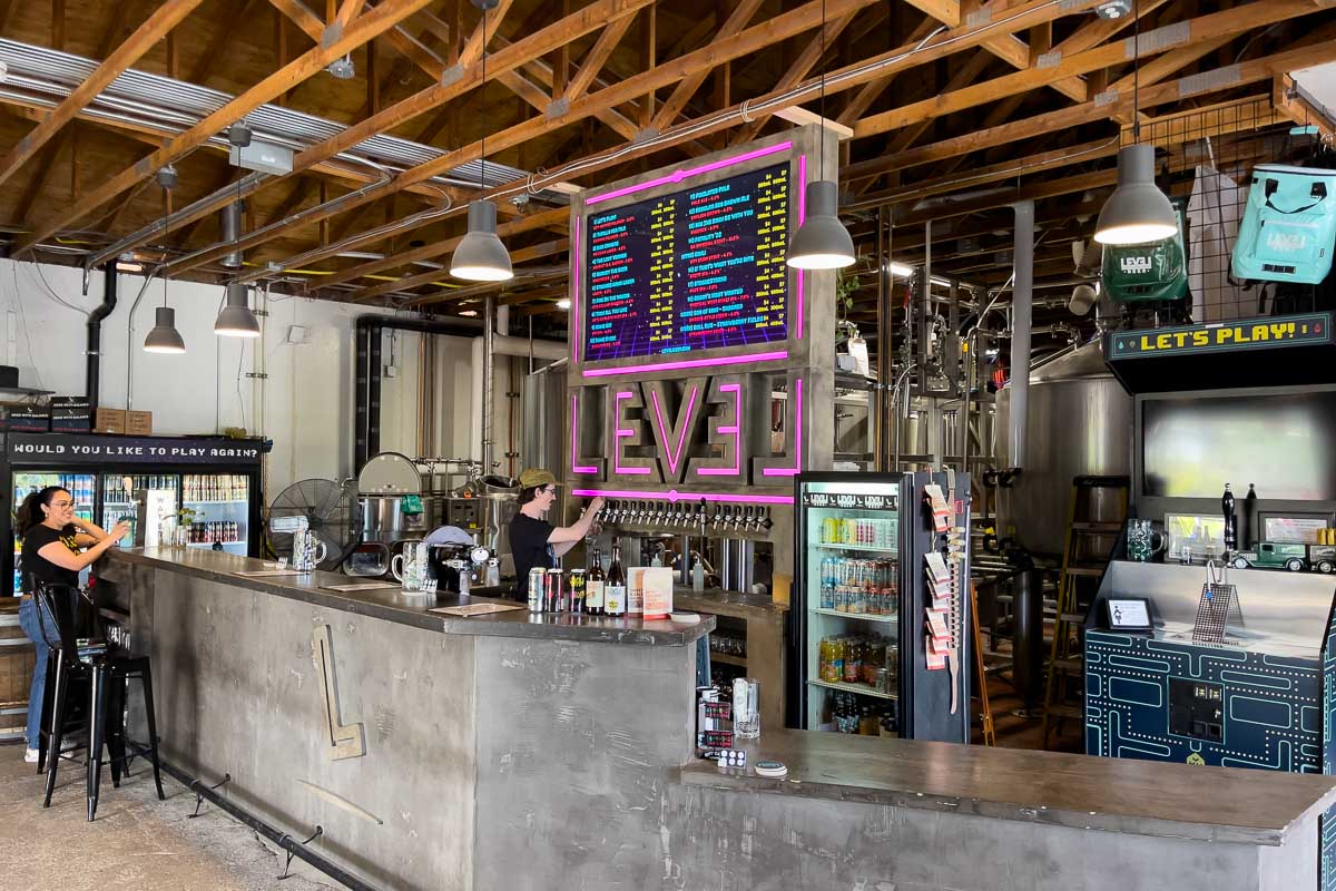 Level Beer inside with arcade looking decor.