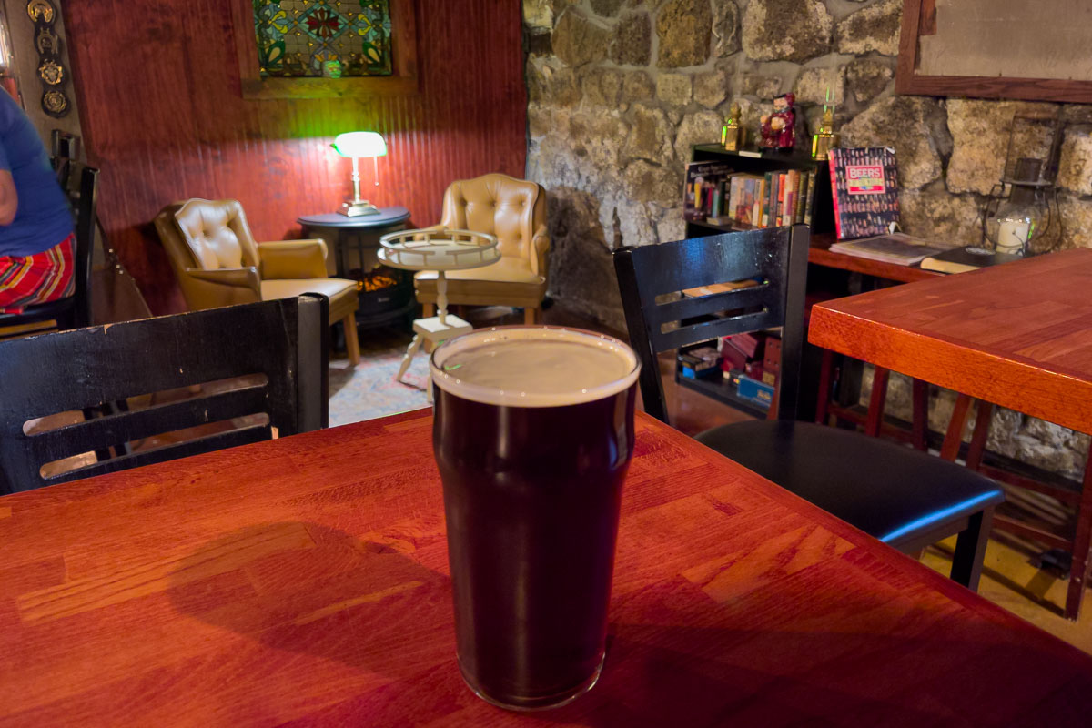 The Cellar inside shot with beer on table.