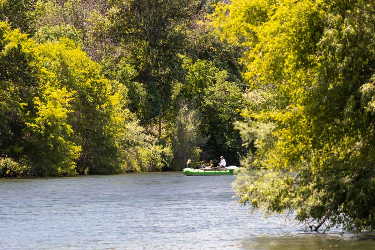 TouVelle State Recreation Park with floaters on calm river.