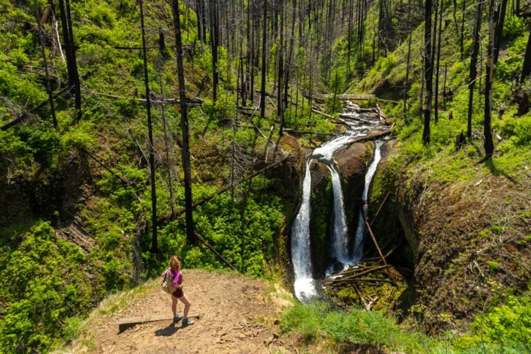 Nina at Triple Falls, a waterfall with three spouts.