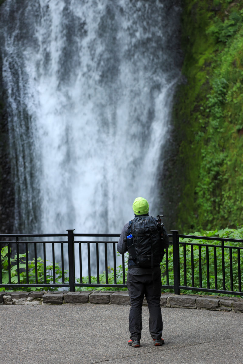 Garrett at waterfall in Kuhl pants.